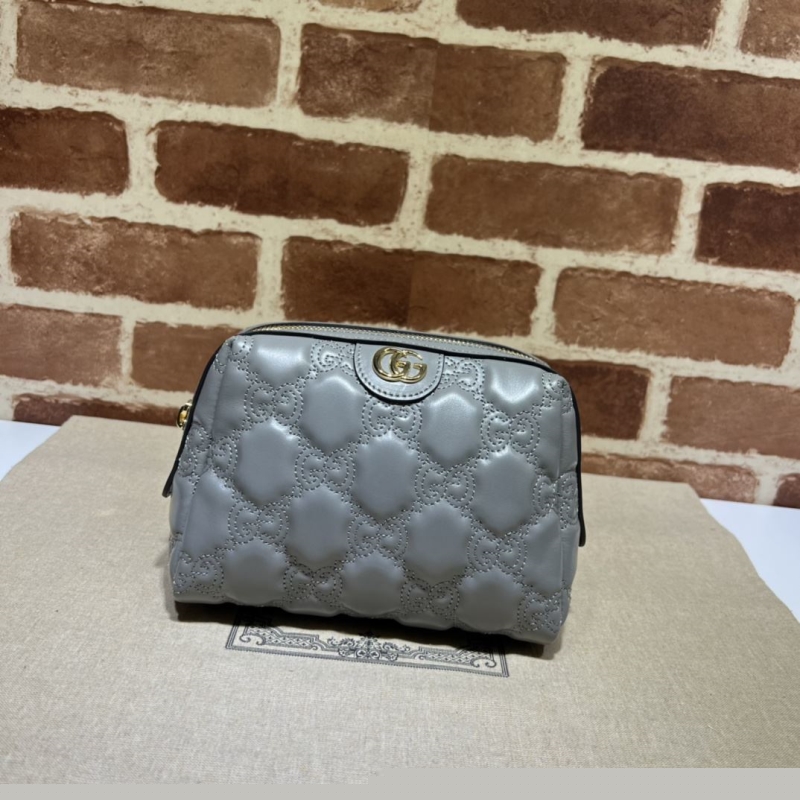 G*u*i clutch bags